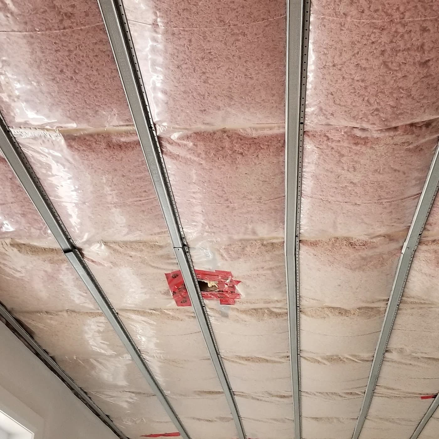 Insulated ceiling with resilient channels in a Black Cedar home under construction