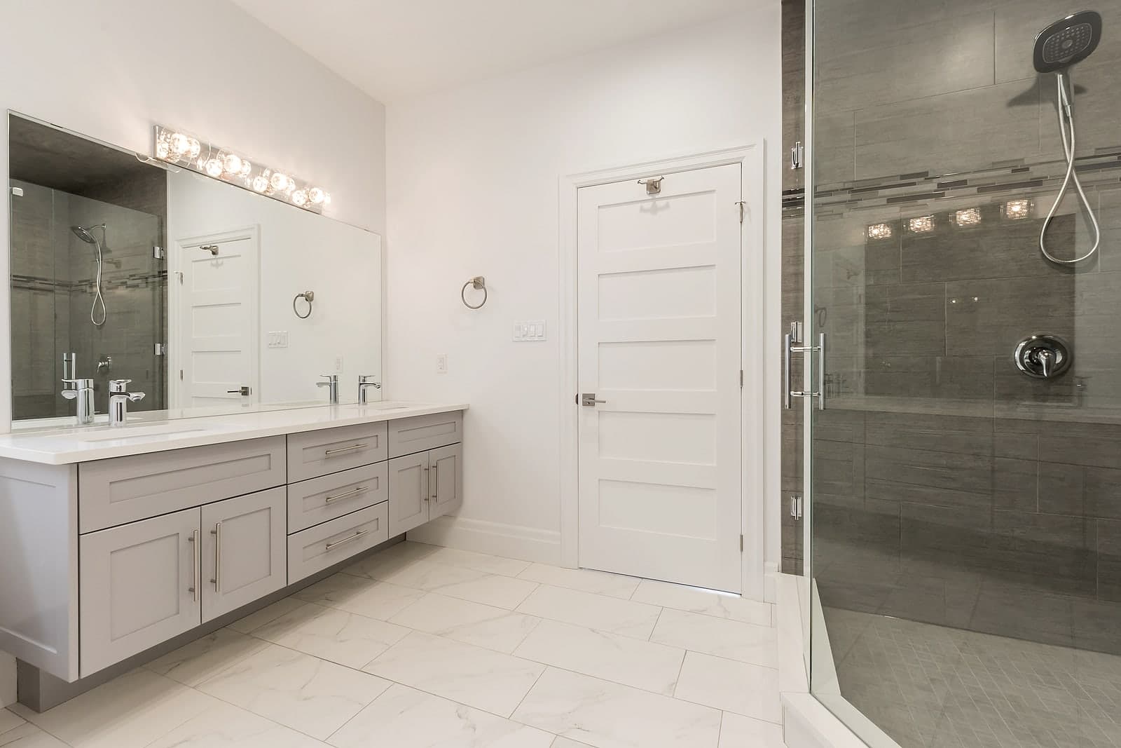Spa-inspired ensuite with double vanity and glass shower at Foxwood Crossings