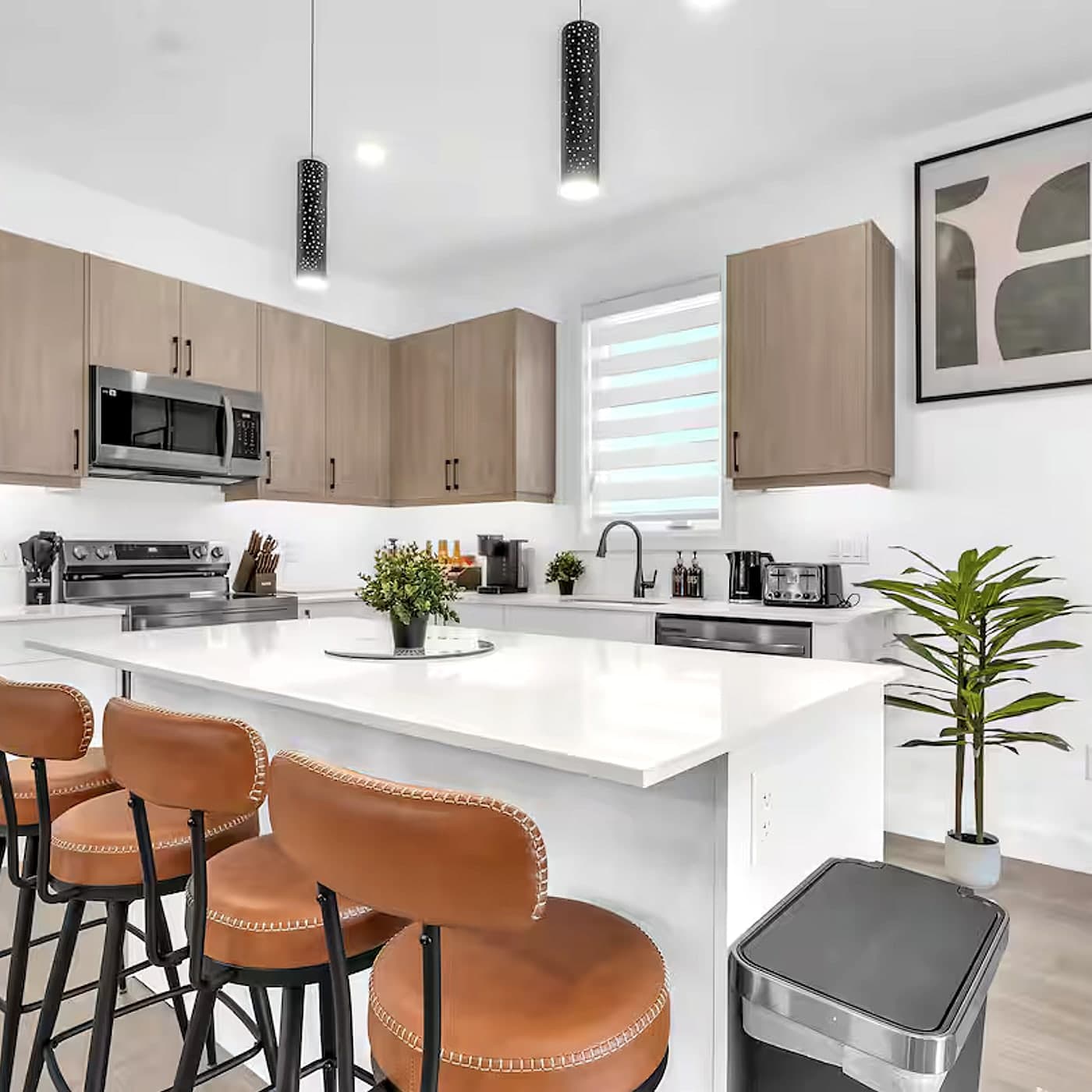 Kitchen island with bar seating and pendant lighting