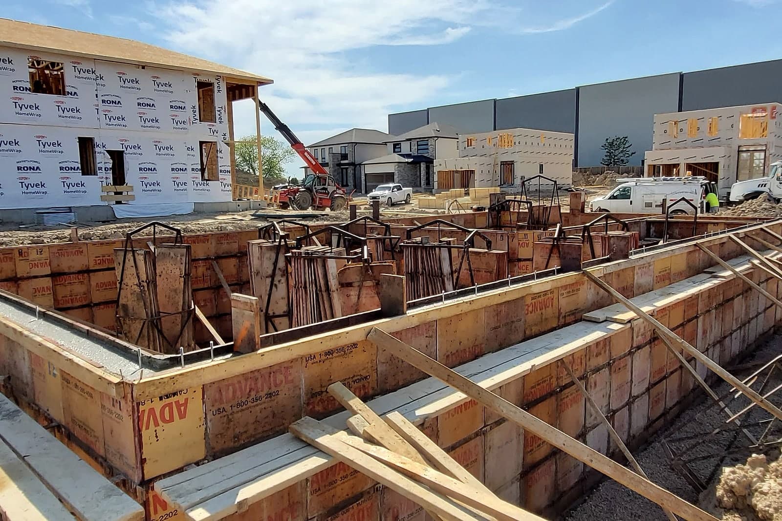 Foundation formwork and reinforcing steel on a Black Cedar build site during the concrete pour