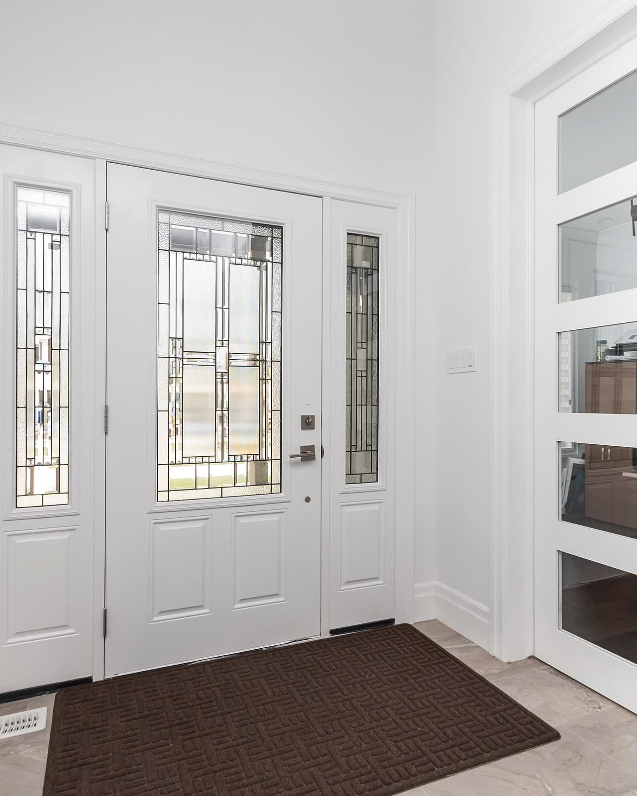 Entry foyer of a completed Black Cedar home in London, Ontario