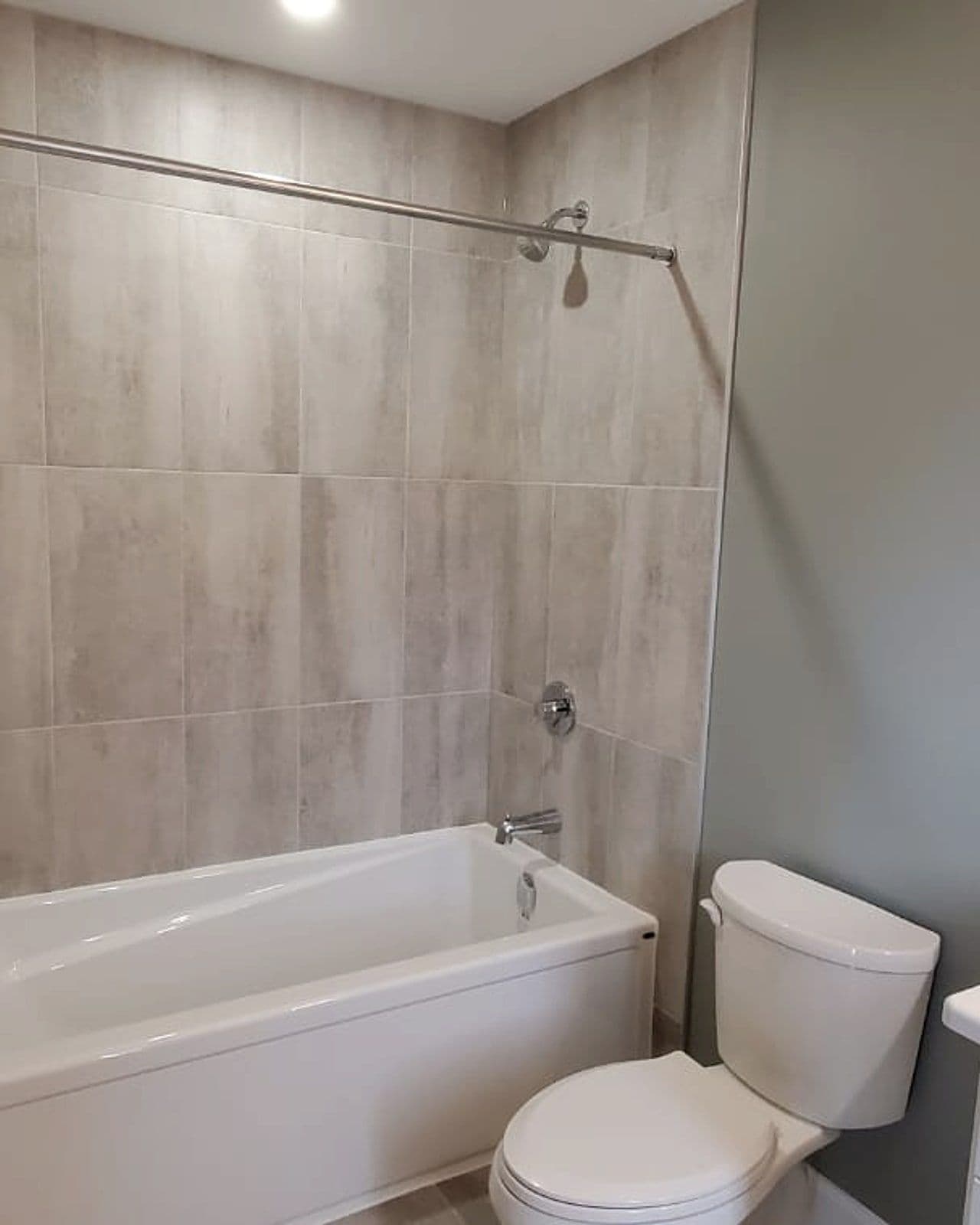 Tiled main bathroom in a Canvas home by Black Cedar