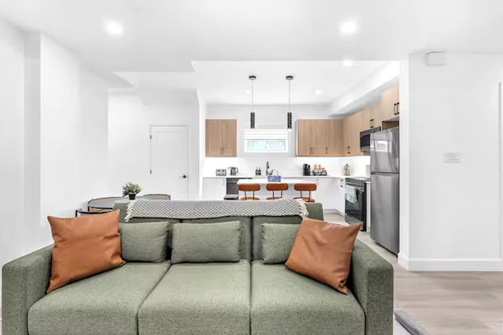 Lower-level living room opening through to the kitchen